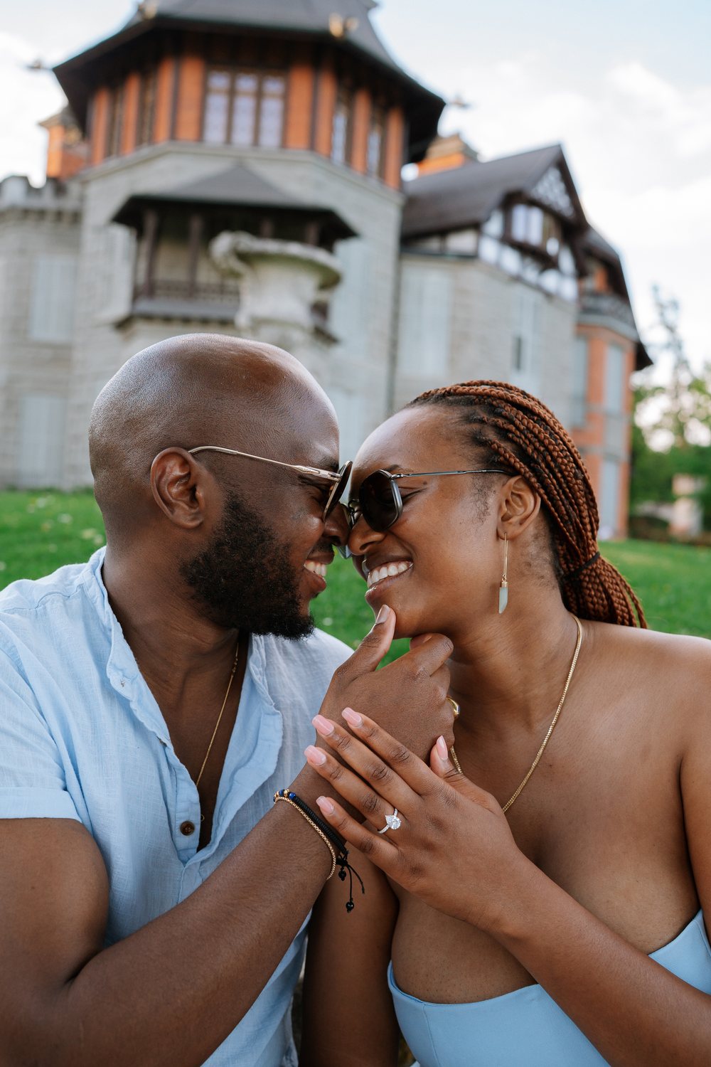 The couple forehead to forehead in golden evening light