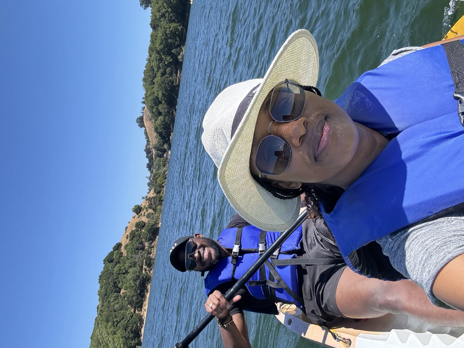 Sally and Adetunji kayaking on a Bay Area reservoir, June 2024