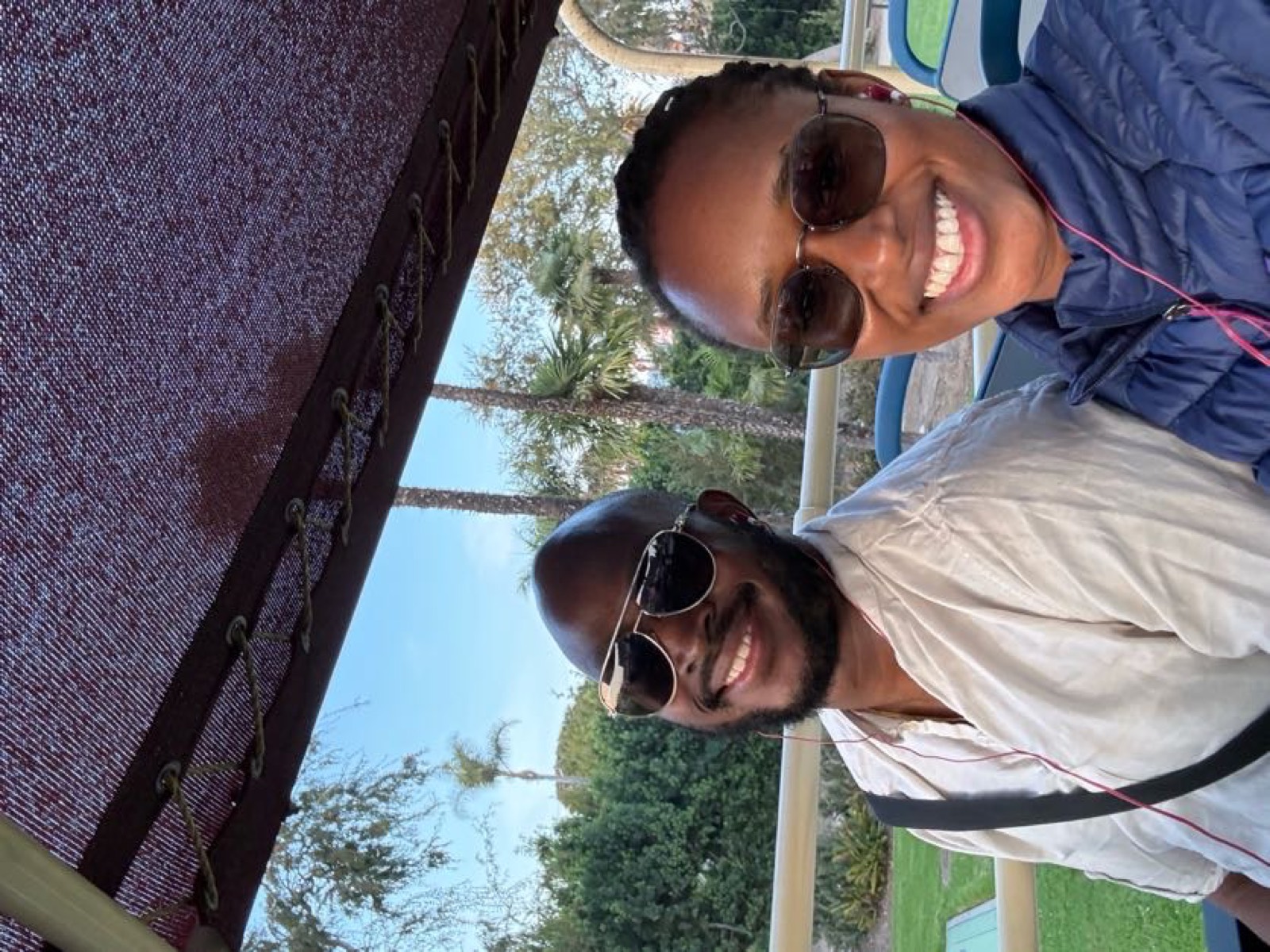 Sally and Adetunji on a tram among the palms in Los Angeles, November 2024