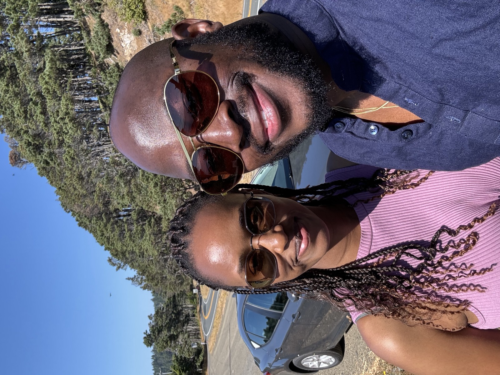 Sally and Adetunji on a coastal road in Mendocino, July 2024