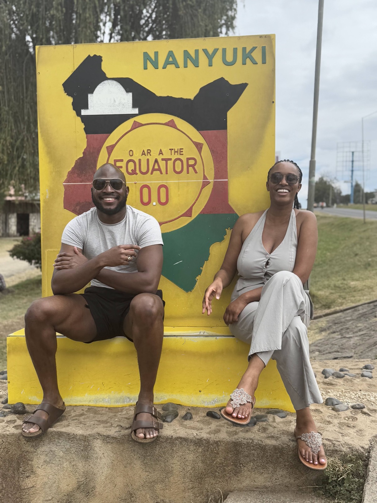 Sally and Adetunji at the Nanyuki equator sign in Kenya, December 2024
