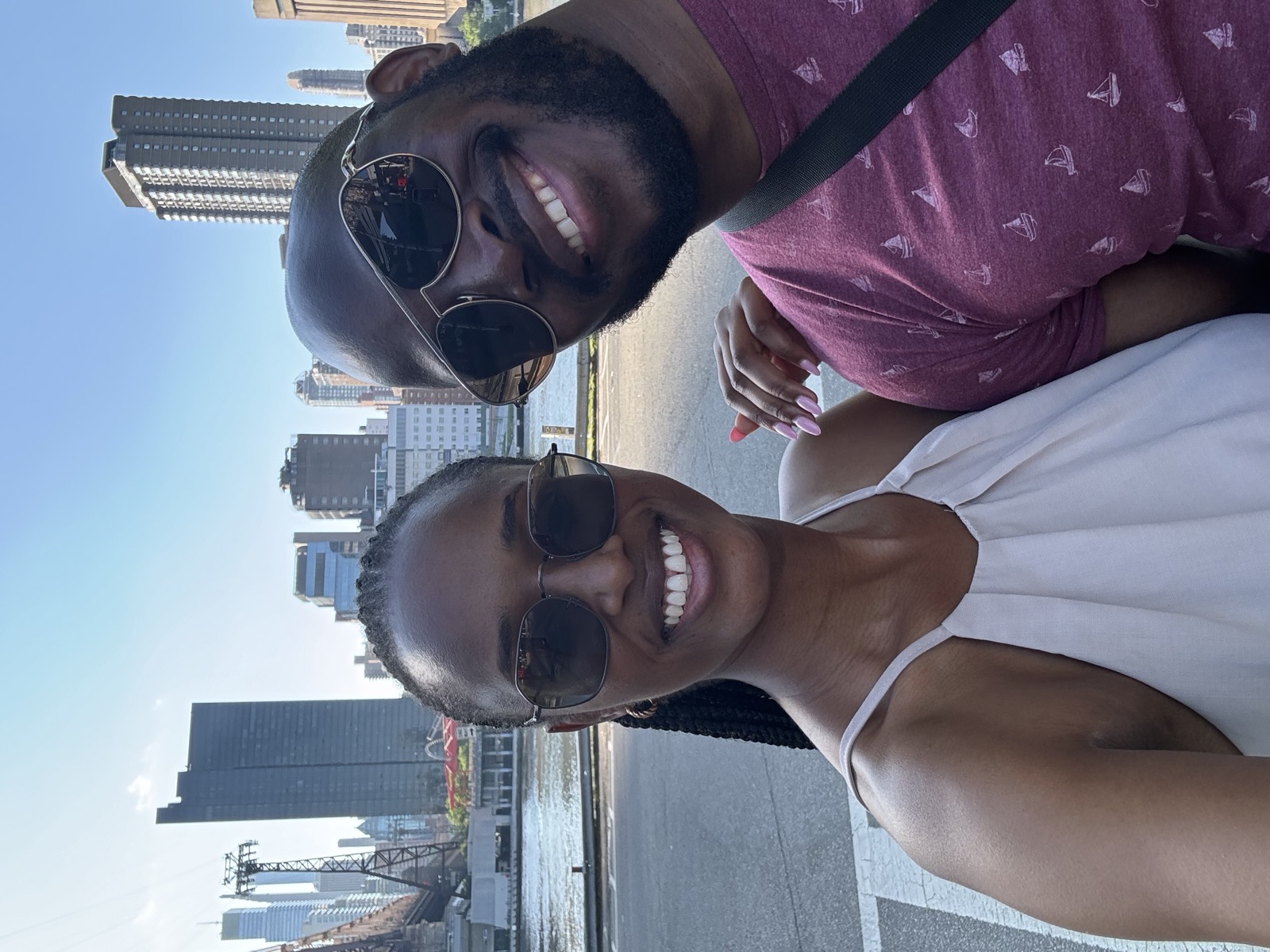 Sally and Adetunji with the New York City skyline behind them, May 2024