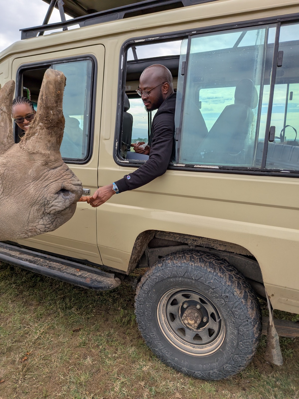 Adetunji and Sally meeting a rhino at Ol Pejeta Conservancy, December 2024